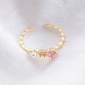 Bague Sertie D'Une Pierre Précieuse Rose Et D'Une Perle